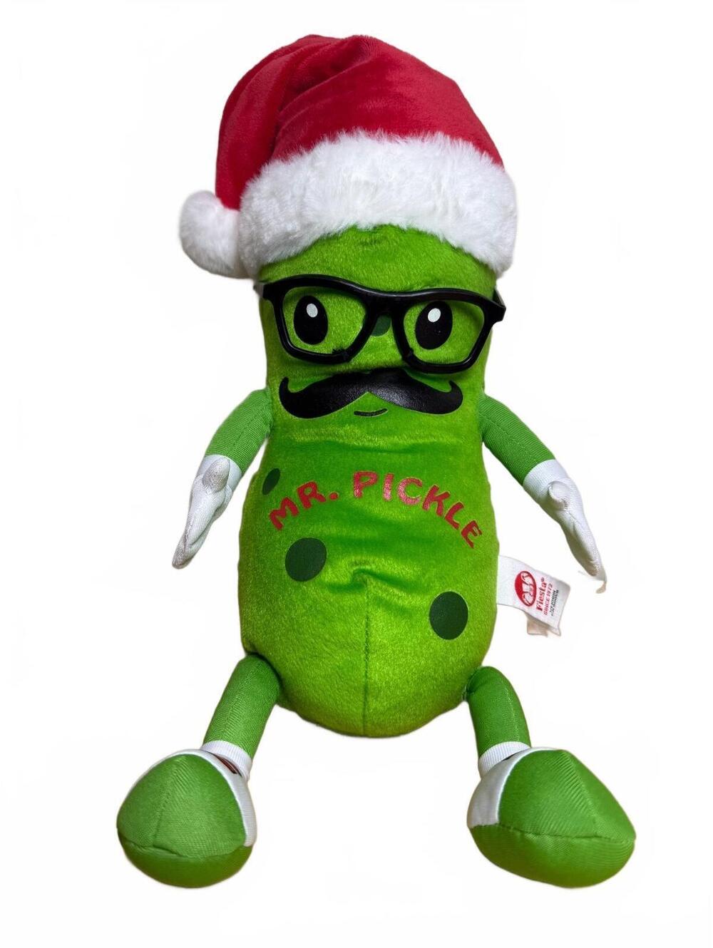 Mr. Pickle plush doll wearing a festive Santa hat